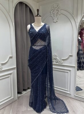 Make a glamorous statement with this luxurious Partywear Sequin Saree designed for women who love sophisticated sparkle.1