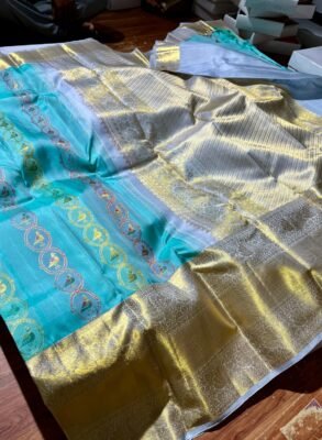 Pure Kanchipuram Resham warp turquoise silk saree with multicolour bird butta designs and silver and gold woven detailing