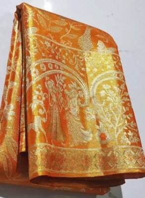 Pure Kanchipuram tissue Meena saree in orange and gold – folded view with ornate motifs