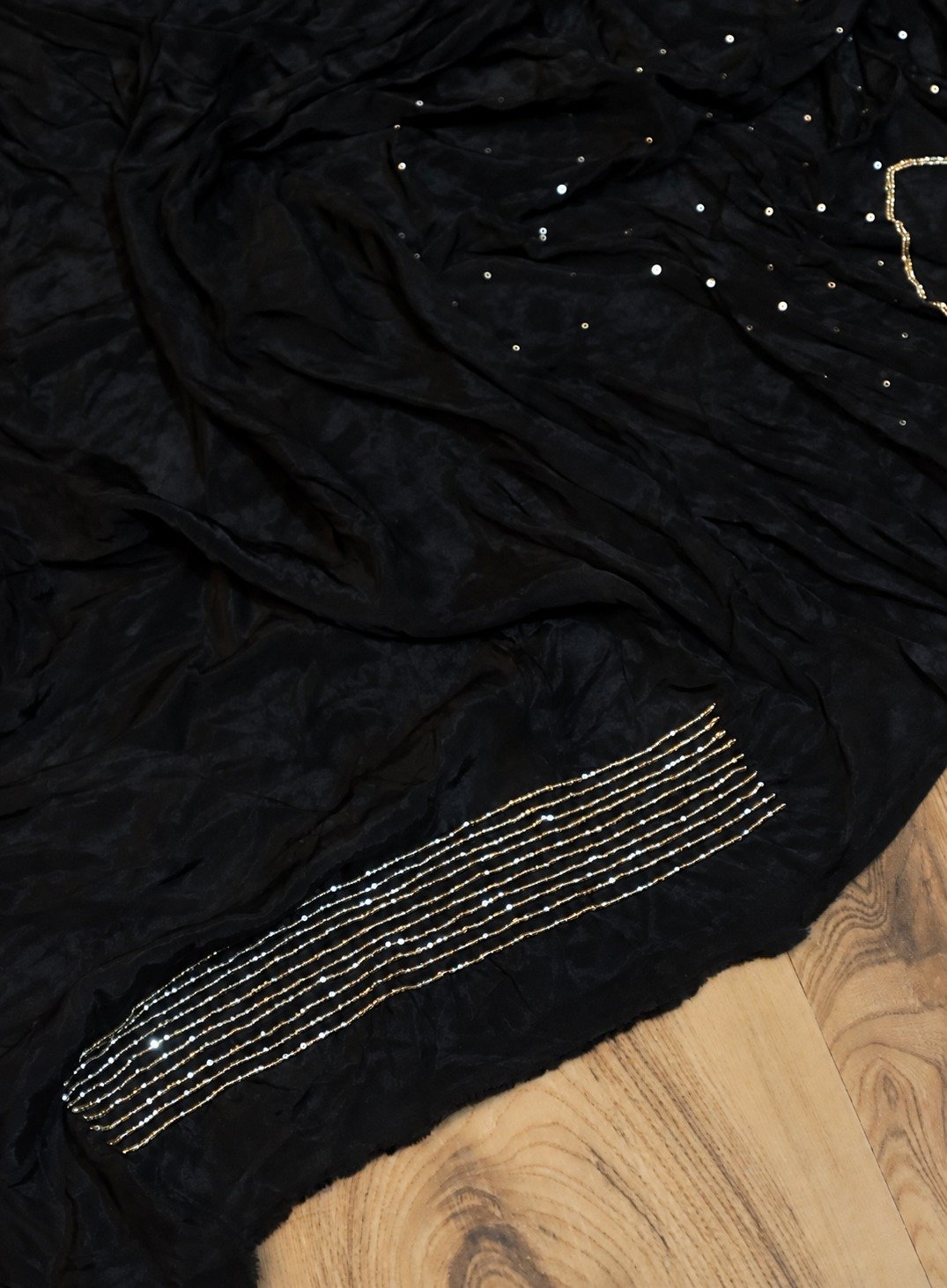 Pure Crepe Silk Saree with Cutdana Handwork 9 Black pure crepe silk saree with vertical cutdana handwork – blouse fabric and cutdana detail