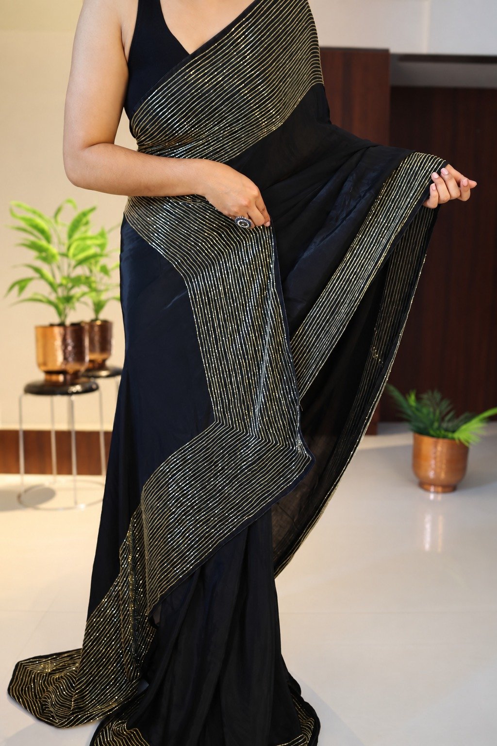 Pure Crepe Silk Saree with Cutdana Handwork 2 Black pure crepe silk saree with vertical cutdana handwork – front drape
