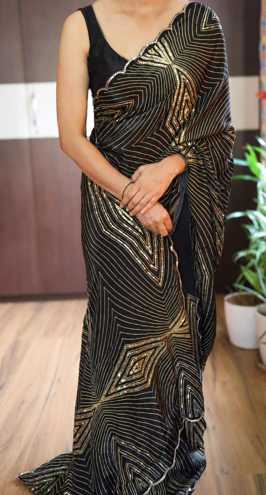 Black Pure Crepe Silk Cocktail Saree with Gold Zari and Sequins 1 Black pure crepe silk cocktail saree with gold zari geometric patterns and handwork sequins