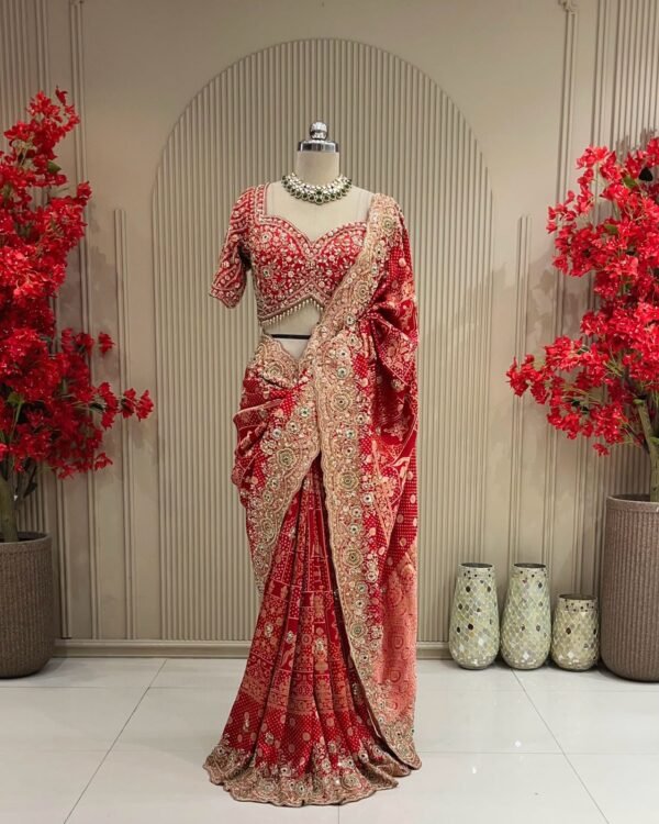 Red embellished party wear saree with gold tone scalloped floral border