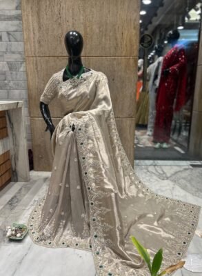 Ivory Embellished Party Wear Saree with Green Stone Border 8 Ivory embellished party wear saree with silver-tone scalloped border and green stones, full drape