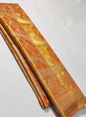 Pure Kanchipattu tissue orange saree with silver and gold zari brocade in folded view