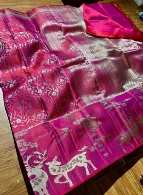 Kanchipuram Resham warp Meenakari saree in rani pink with floral weaving, animal-motif border and silver-tone pallu