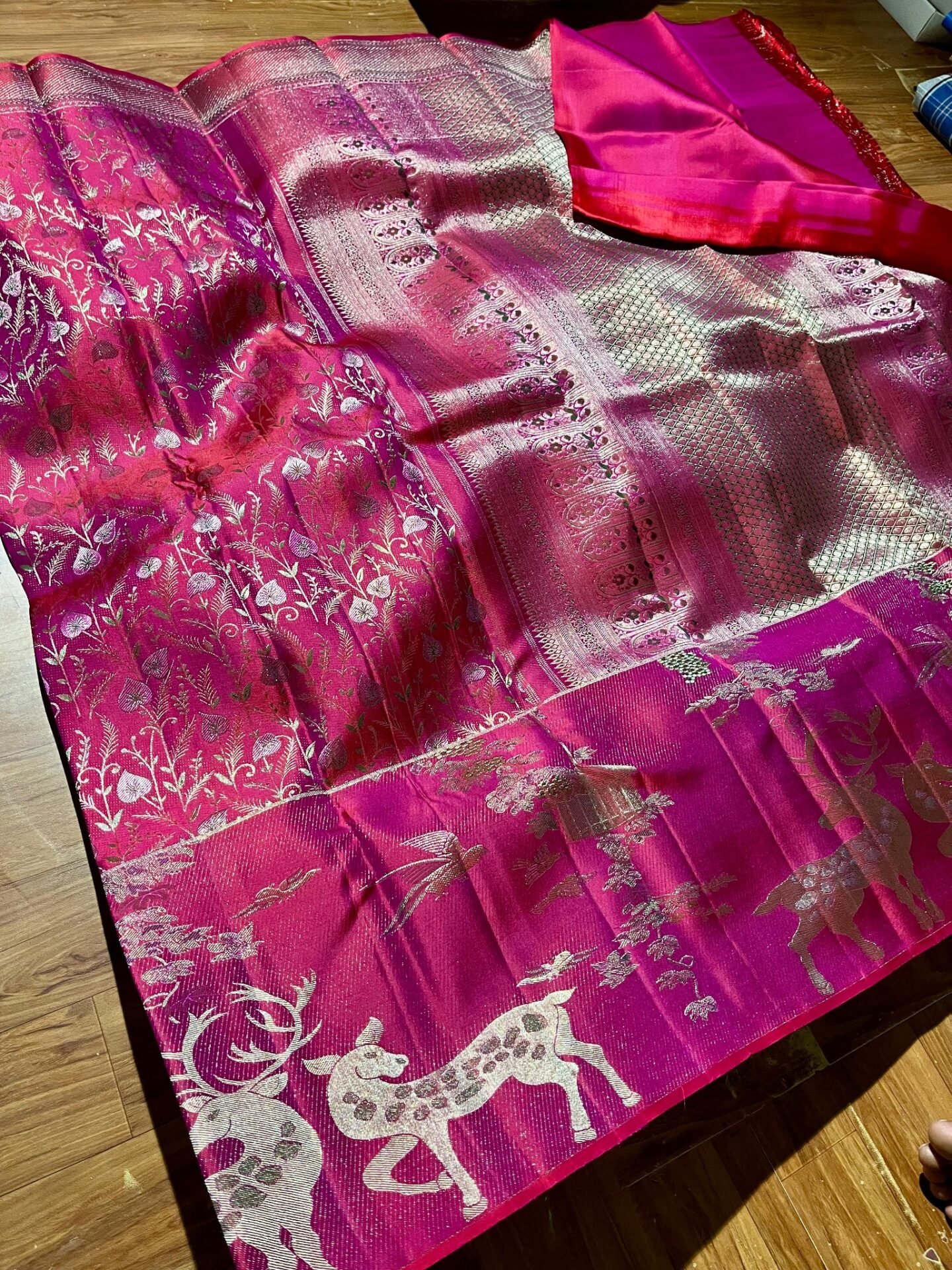Pure Kanchipuram Resham Warp Meenakari Saree – Rani Pink 1 Kanchipuram Resham warp Meenakari saree in rani pink with floral weaving, animal-motif border and silver-tone pallu
