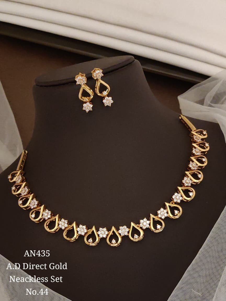 AD White Floral Teardrop Necklace Set 1 AD White Floral Teardrop Necklace Set in gold-tone finish