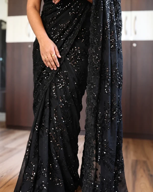 Black net saree with sequins and pearl embroidery – front view