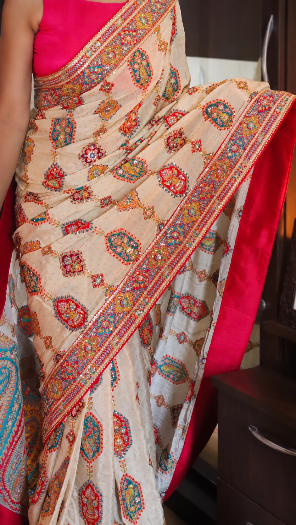 Designer Crepe Satin Saree with Aari Work & Rajasthani Patchwork 2 Sequin shimmer and Rajasthani patchwork embroidery detail on crepe satin saree