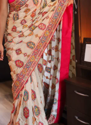 Designer Crepe Satin Saree with Aari Work & Rajasthani Patchwork 12 Cream designer crepe satin saree with Aari work and multicolour Rajasthani patchwork
