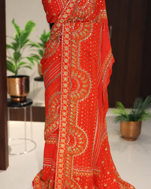 Red orange pure georgette saree with mirror and sequin handwork