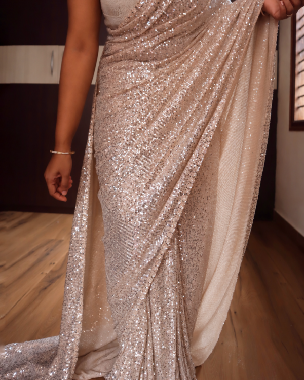 Champagne beige Lycra sequin saree full drape and pearl handwork borders