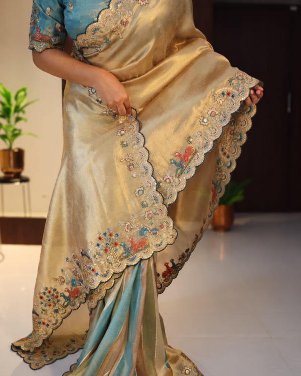 Banarasi tissue silk saree in gold and blue with floral deer and bird embroidery