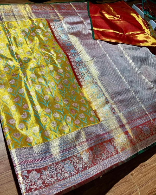 Golden-yellow pure Kanchipuram tissue silk saree with edge-to-edge floral brocade, border and pallu