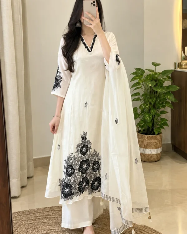 Off white Mul Chanderi suit with black floral embroidered V-neck, hem and sheer dupatta